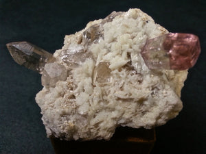 Tourmaline, topaz and quartz on a matrix of feldspar and albite.