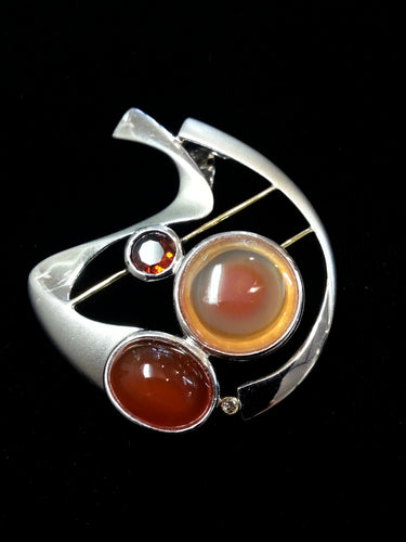 Pendant made with carnelian, agate, garnet, diamond.