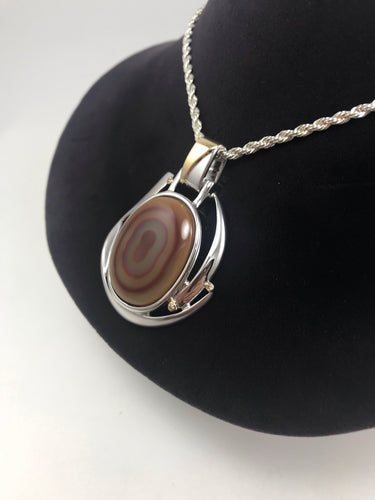 Agate pendant, with diamond accent stones.
